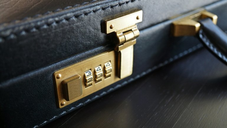 Modern professional travel briefcase on airport seat showcasing organization and durability for business trips