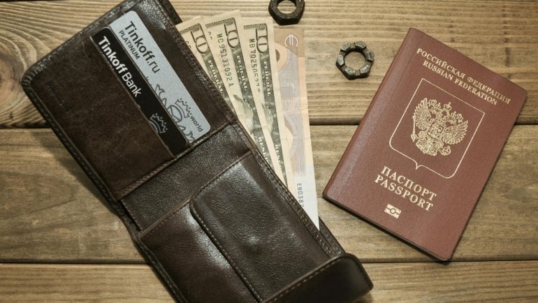 Traveler wallet with passport, cash, and credit cards showcasing organized compartments and travel essentials