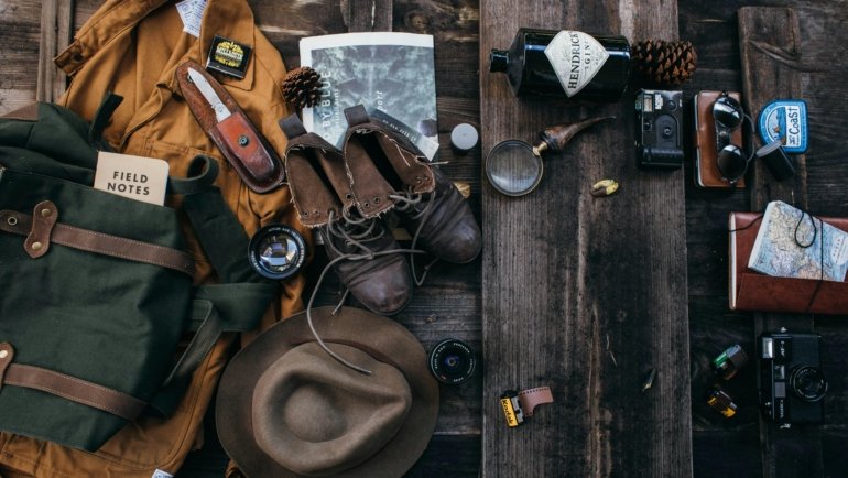 Durable leather travelers notebook cover on wooden table representing travel journaling and adventure