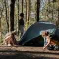 Teenagers enjoying outdoor adventure travel camp activities like hiking and cultural exploration in a safe and structured setting