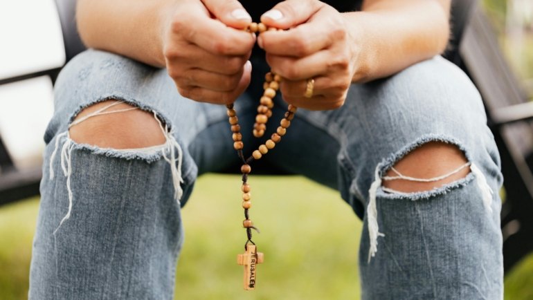 Traveler praying peacefully before starting a journey seeking protection and blessings