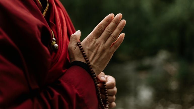 Traveler peacefully praying for safety and protection during journey with calm surroundings