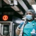 Certified nursing assistant standing in front of temporary housing during a 13 week travel healthcare contract