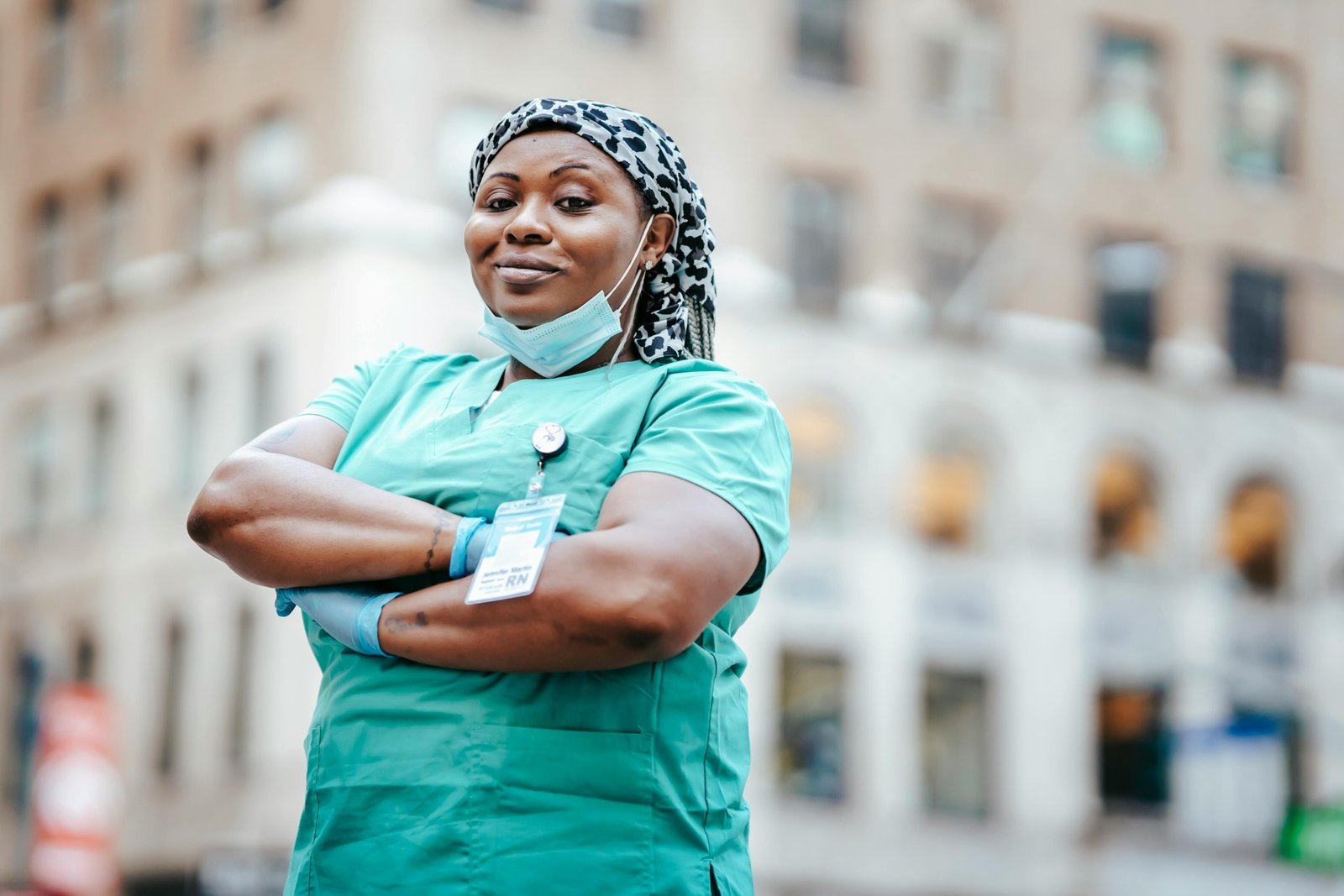 Certified Nursing Assistant smiling in a city during travel assignment, representing high-paying travel CNA jobs and adventure