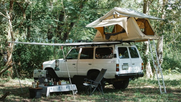 Portable travel fridge keeping food and drinks fresh during road trip camping