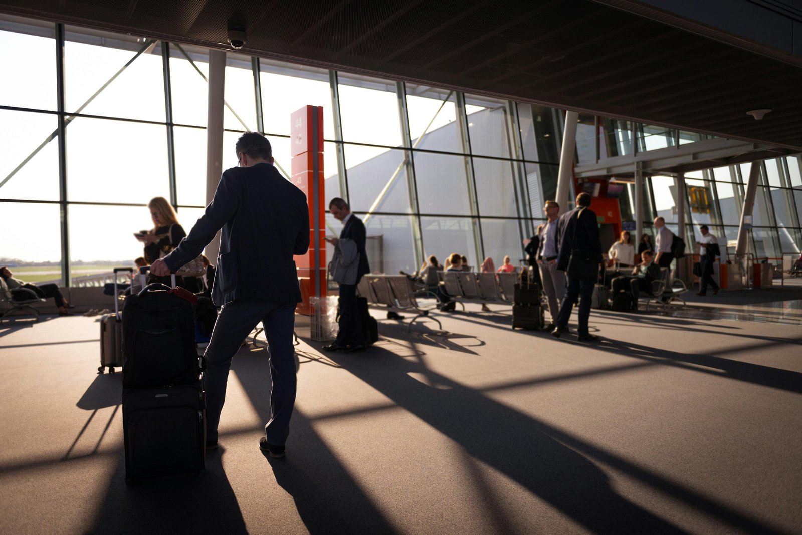 Traveler with suitcase at airport symbolizing global travel and journey