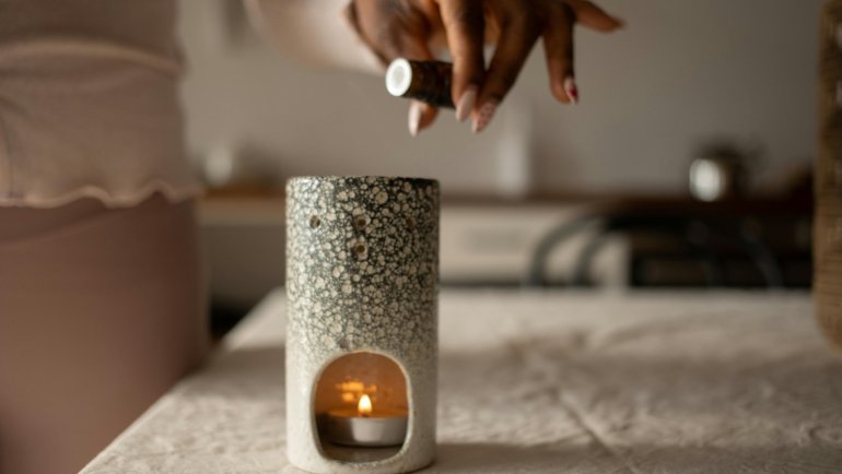 Travel friendly portable essential oil diffuser attachment in use during a trip with compact design and cordless power options