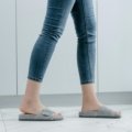 Aime Leon Dore travel slippers worn with casual outfit, showcasing stylish and comfortable footwear for travelers
