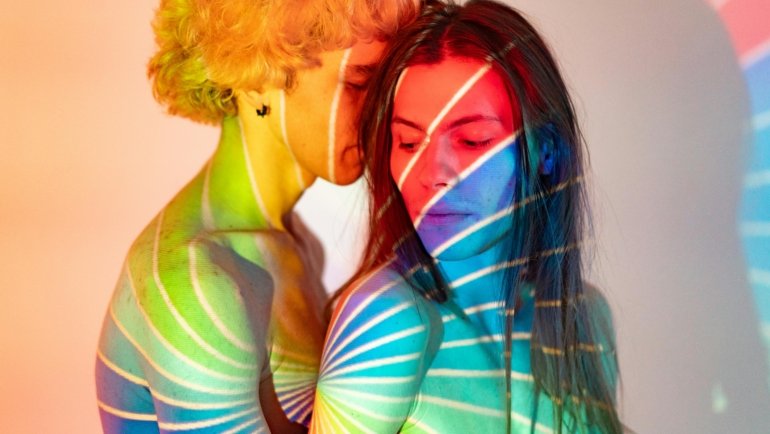 Romantic couple embracing with abstract time travel background representing love and time in The Time Traveler's Wife