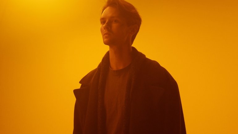 Lonely character trapped in a futuristic city representing time travel and fate as an unlucky NPC