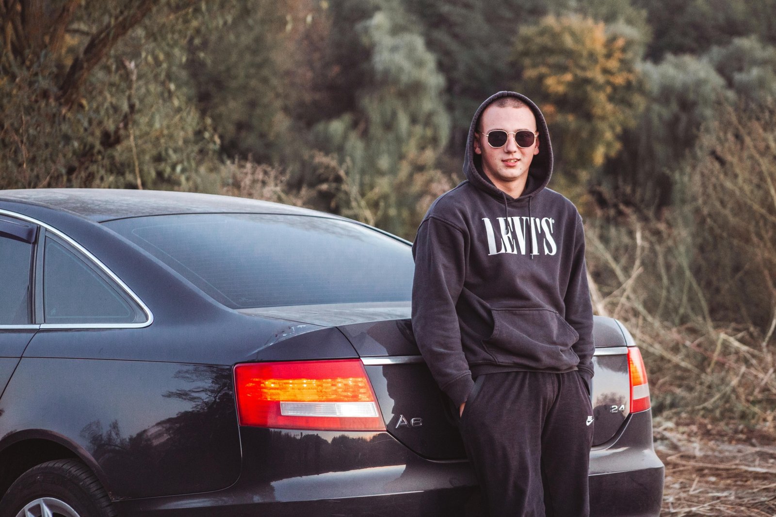 Traveler wearing a comfortable travel hoodie with hidden pockets to safely secure valuables while on the move