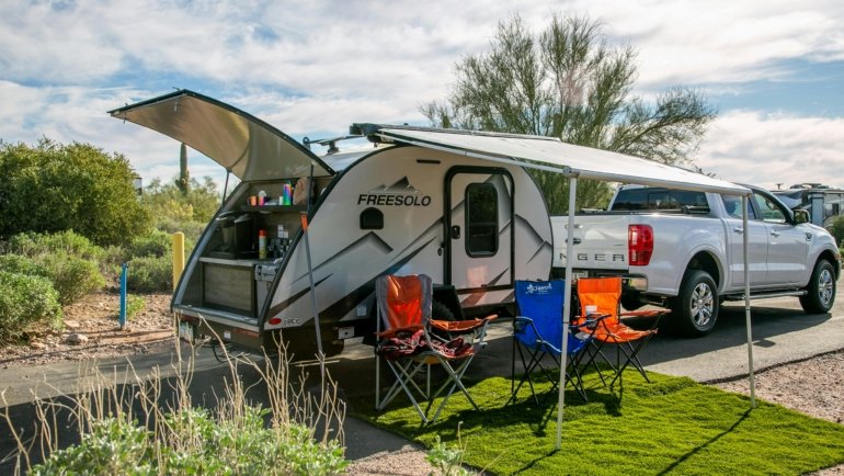 Northwood travel trailer parked in a rugged outdoor setting showcasing durability and comfort for all-season camping