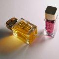 Le Labo luxury travel perfume set with elegant packaging next to a travel bag, ideal for stylish fragrance lovers on the move