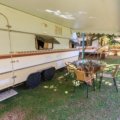 Travel trailer with electric awning extended creating a comfortable outdoor living space