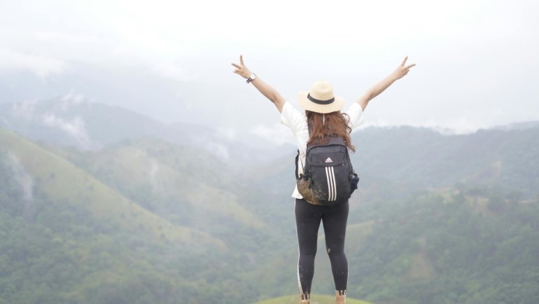 Solo traveler exploring nature alone, symbolizing freedom and creativity in travel