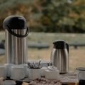 Starbucks coffee traveler large container with cups being shared by a group during a meeting or travel event