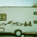 Ibex lightweight off-road travel trailer parked in nature with rugged tires and compact design for adventure camping