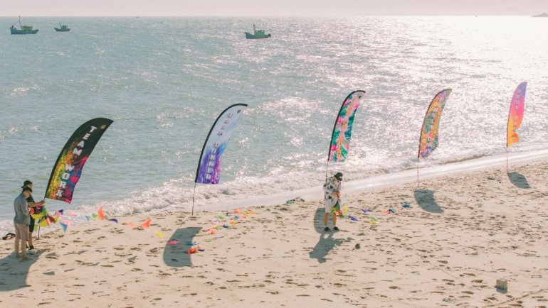 Sunny beach in Ghana during dry season with cultural festival and people enjoying outdoor activities