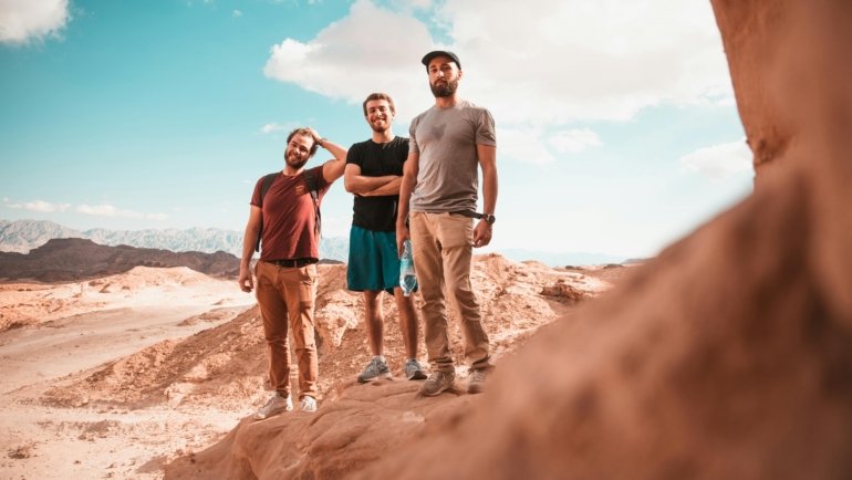 Man wearing breathable, wrinkle-resistant travel shirt with UV protection on outdoor adventure