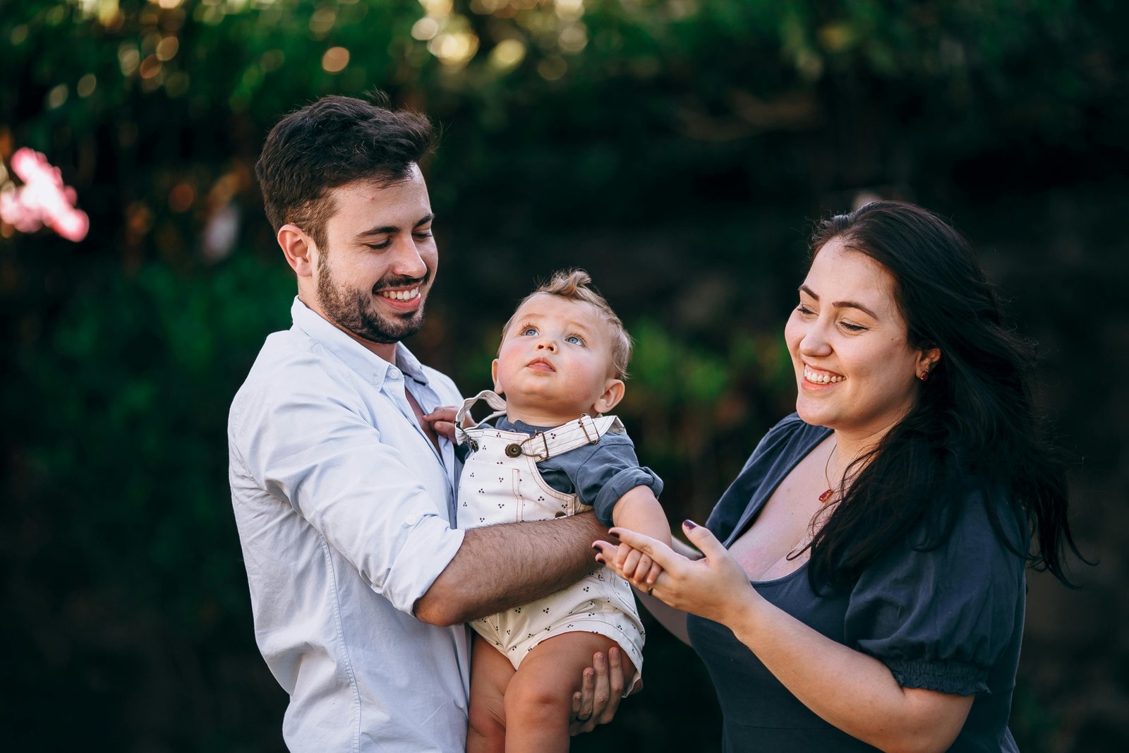 Family traveling with infant enjoying a peaceful outdoor setting during a family-friendly vacation