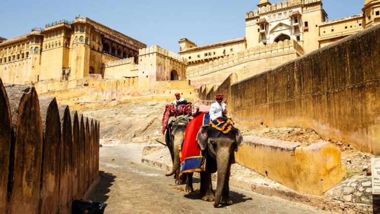 Traveler enjoying a cultural tour of iconic Indian landmarks and local traditions