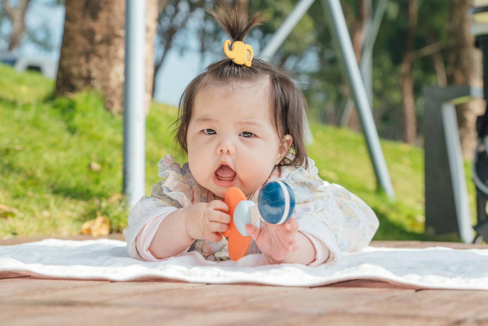 Lightweight portable baby playard for travel set up in a car trunk, showcasing convenience and safety for traveling families