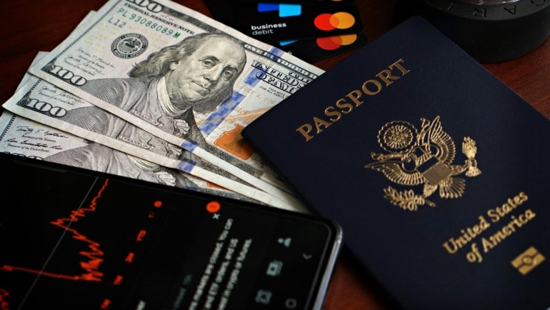 Traveler wearing a slim travel money belt under clothes to securely hold cash and passport