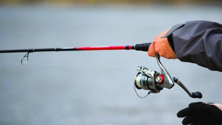 Compact lightweight travel fishing rod ready for use in outdoor fishing adventure