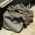 Slow cooker safely packed in a heat-resistant padded travel bag for easy transportation and food warmth