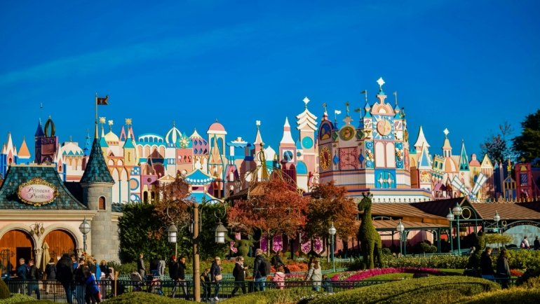 Happy family planning a Disney vacation with travel agent assistance