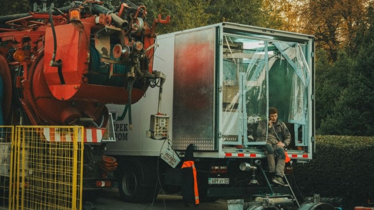 Close-up of a KZ travel trailer being serviced with genuine replacement parts and tools for safe and reliable maintenance