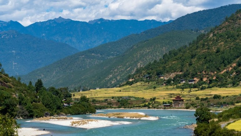 Springtime Himalayan landscape in Bhutan with blooming rhododendrons and clear mountain views