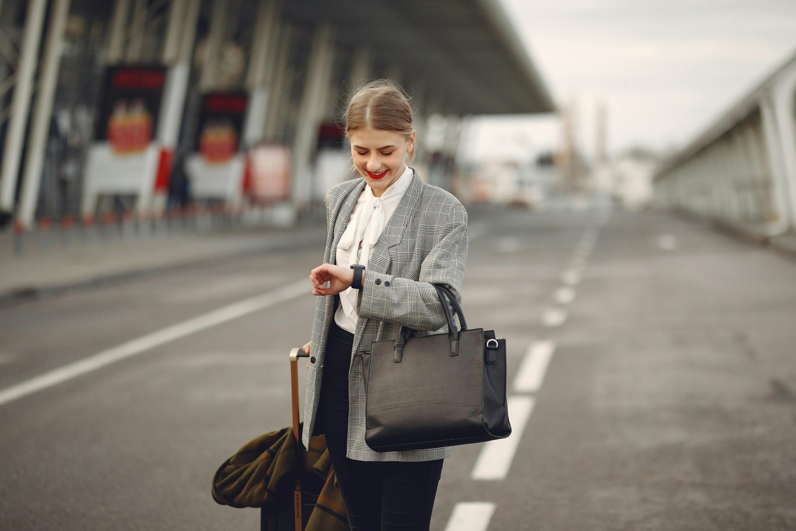 Stylish woman carrying a practical handbag while traveling in a city, combining fashion and function