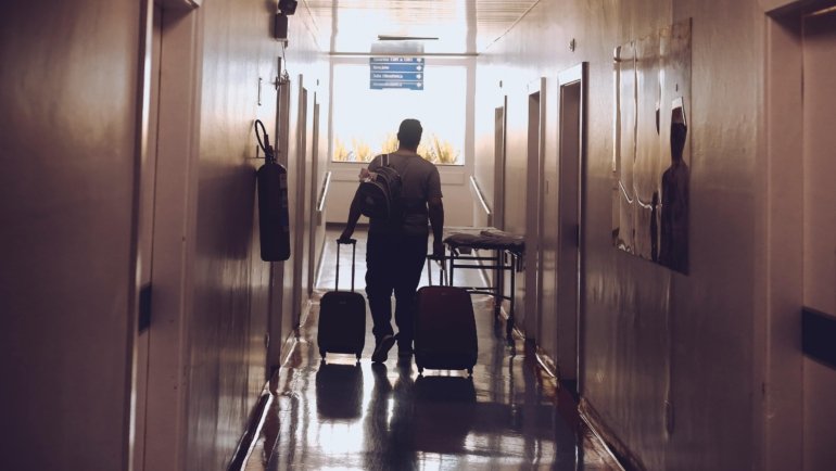 Travel phlebotomist in temporary housing preparing for healthcare assignment