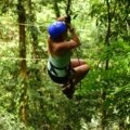 Solo traveler exploring lush rainforest in Costa Rica enjoying adventure and nature