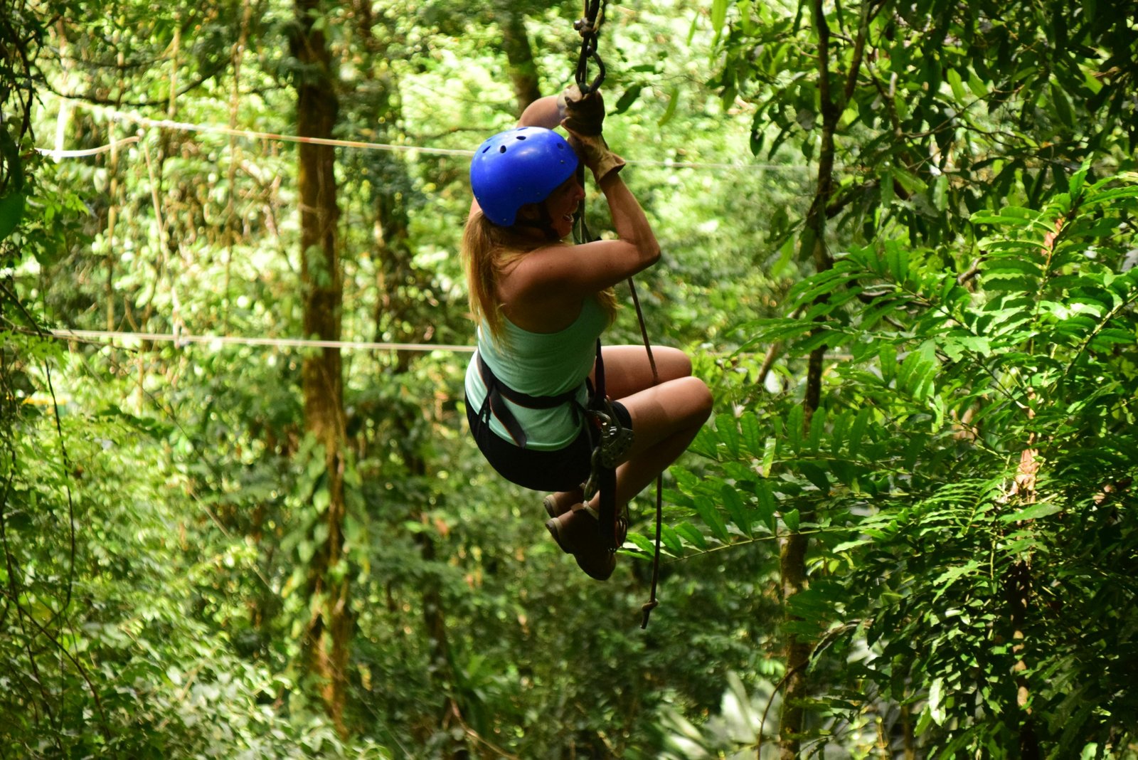 Solo traveler exploring lush rainforest in Costa Rica enjoying adventure and nature