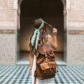 Female solo traveler exploring a vibrant city street embracing local culture and lifestyle