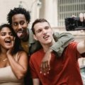Group of friends laughing and having fun during a travel adventure, embodying the humor and joy of funny travel moments