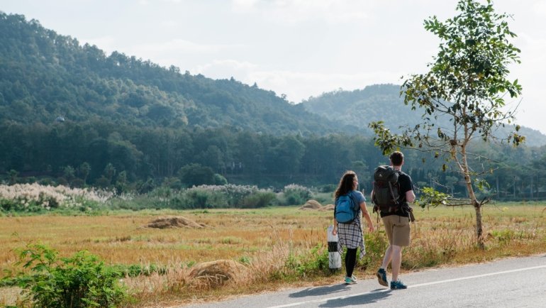 Nomadic traveler enjoying freedom on the road with health insurance coverage for medical emergencies