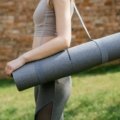 Foldable travel yoga mat neatly folded and packed for easy transport, perfect for travelers seeking portable and durable yoga gear.