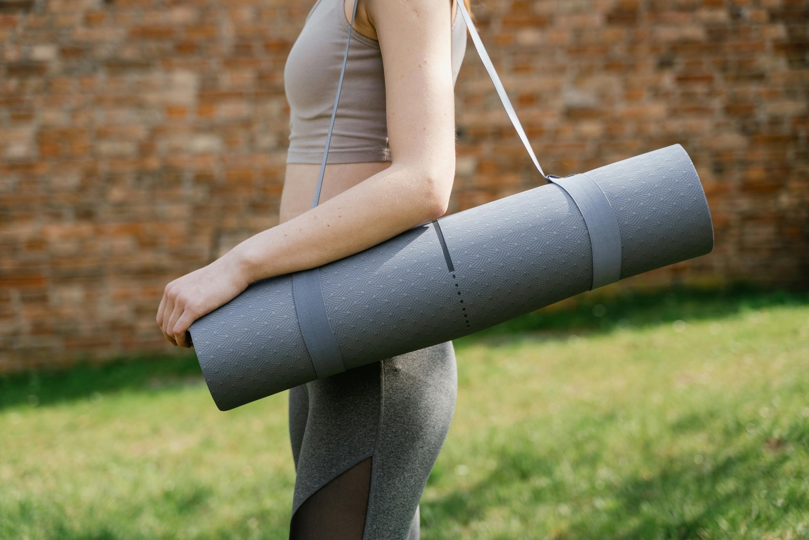 Foldable travel yoga mat neatly folded and packed for easy transport, perfect for travelers seeking portable and durable yoga gear.