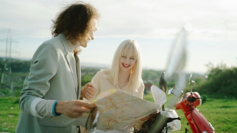 Happy diverse travelers planning a customized trip with expert travel agency support