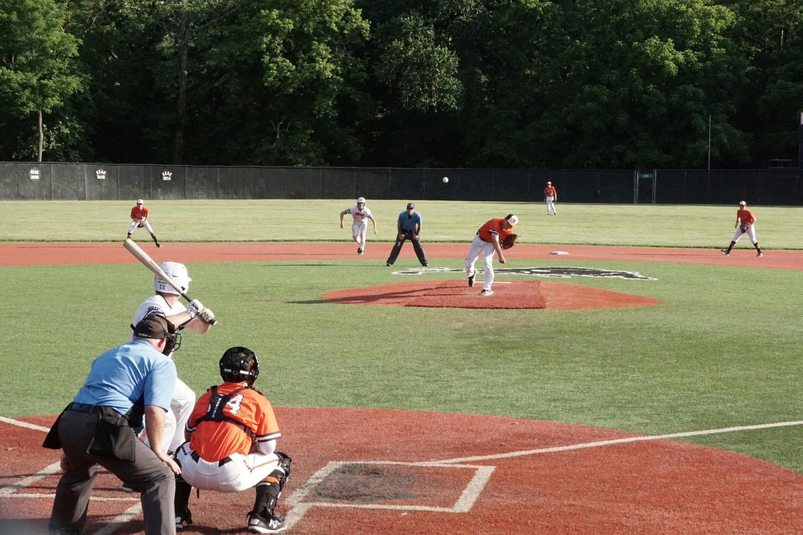 Youth baseball team competing in a travel tournament outdoors, representing Arkansas travel baseball competition and player development