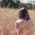 Person enjoying nude travel in nature embracing freedom and body positivity