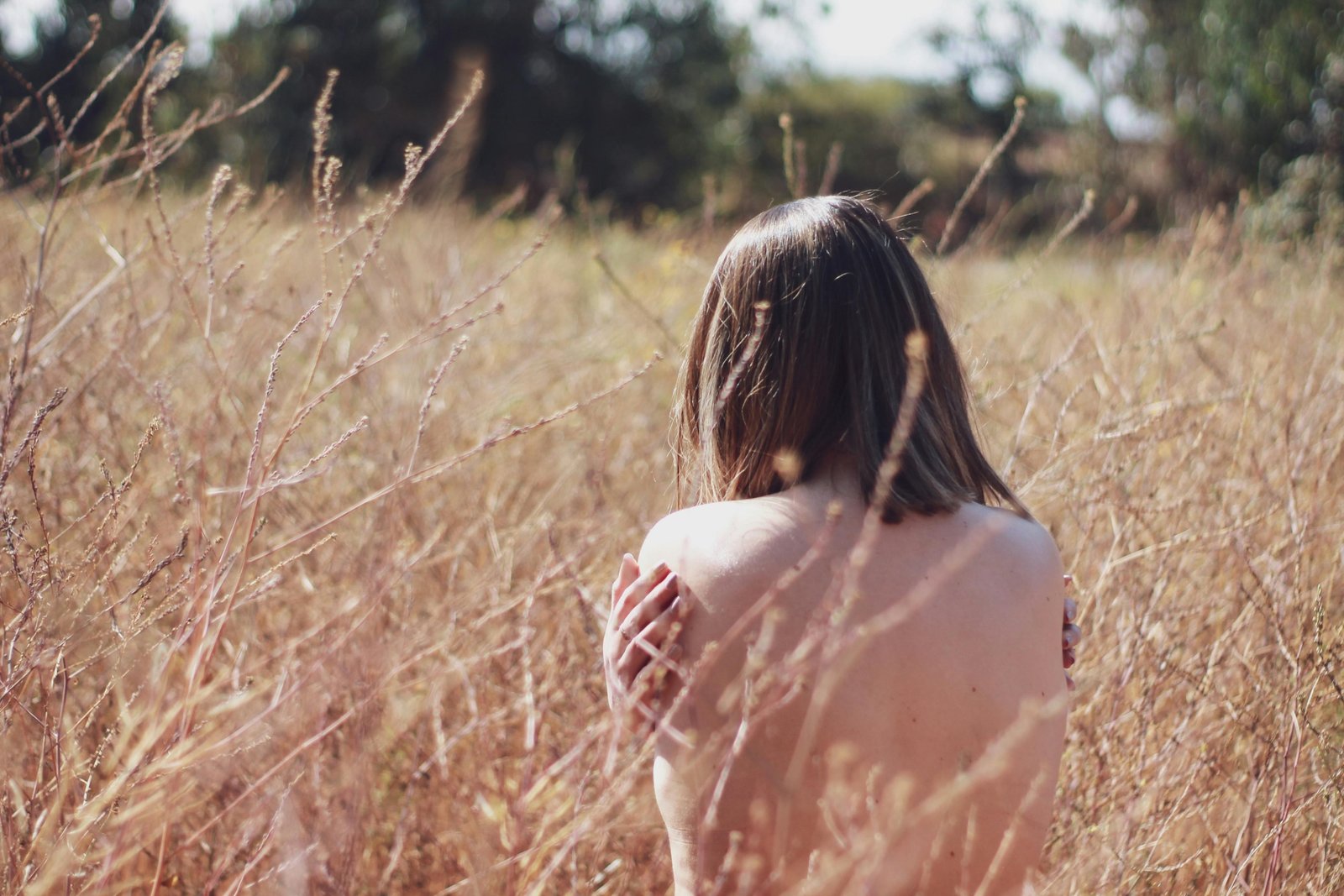 Person enjoying nude travel in nature embracing freedom and body positivity