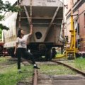 Traveler wearing black travel pants exploring city and nature, showcasing comfort and style for versatile travel wear