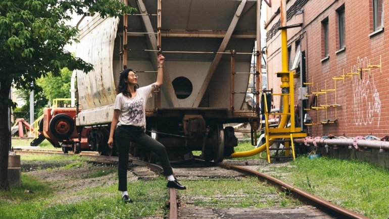 Traveler wearing black travel pants exploring city and nature, showcasing comfort and style for versatile travel wear