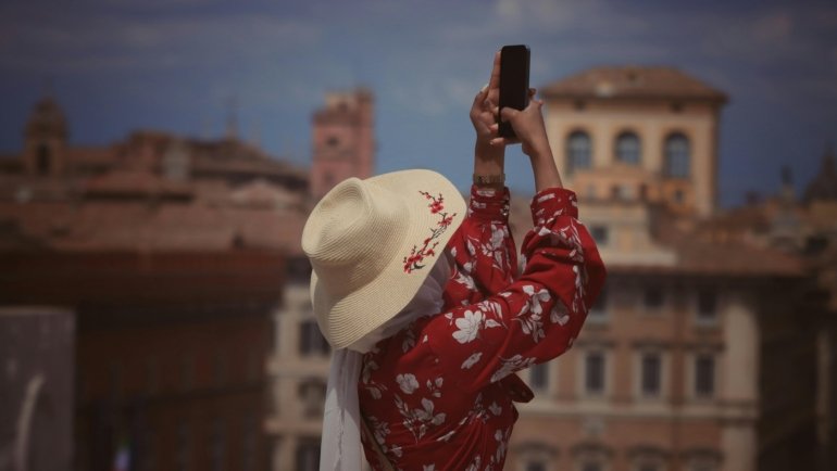 Solo traveler enjoying exploring a vibrant European city with historic buildings and friendly streets
