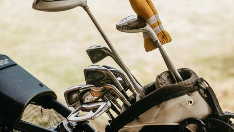 durable golf club travel case being handled at airport for protection during travel