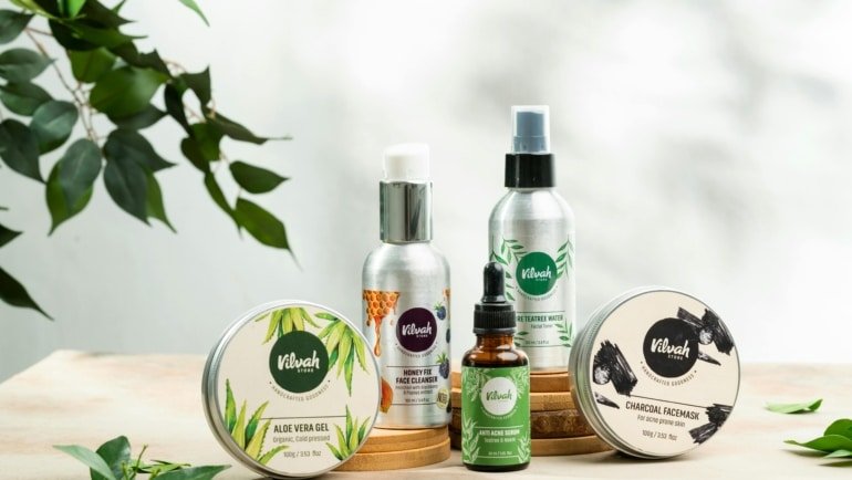 Travel size aloe vera gel bottle with travel essentials for soothing and hydrating skin on vacation